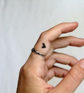 black heart tattoo  on the finger