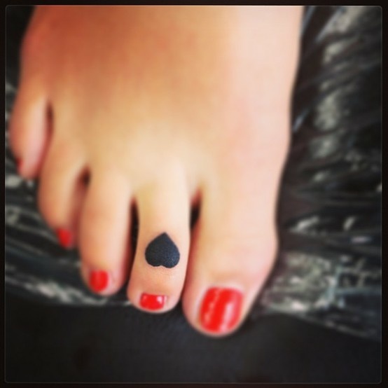 black heart tattoos on the foot