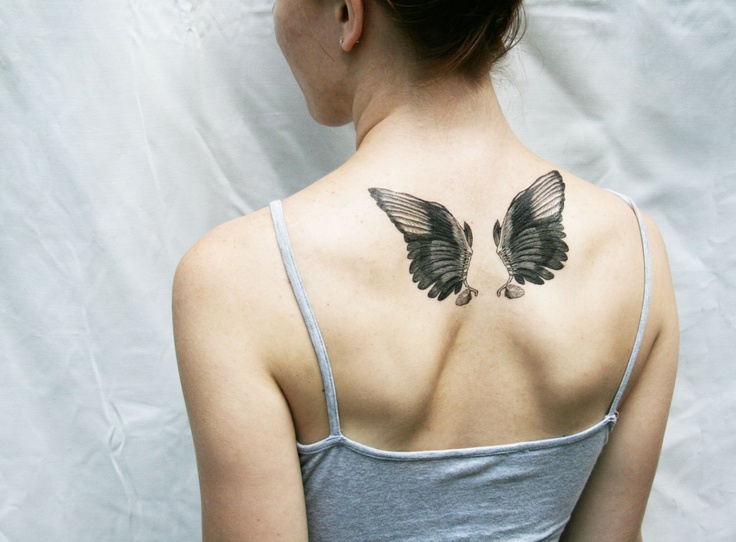 black wings tattoo small angel