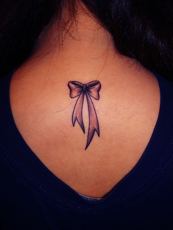 bow tattoos upper back