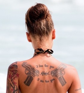 cool guns tattoo girl