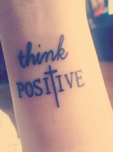 cross tattoo think positive