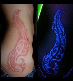 red tribal tattoo shining
