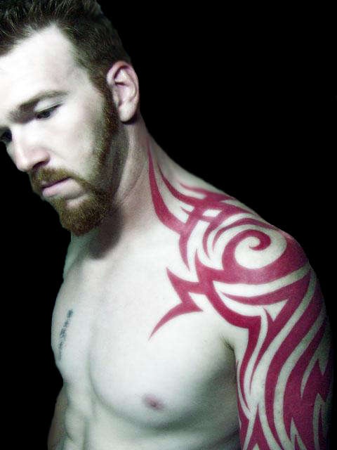 red tribal tattoo shoulder