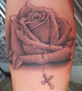 A beautiful rose with a cross