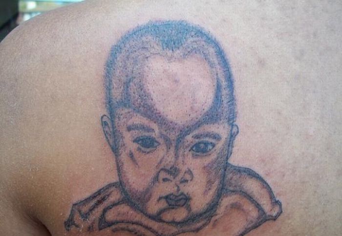 Angry baby tattoo