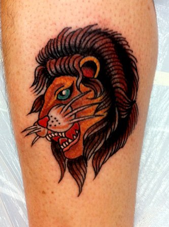Angry lion tattoo by Robert Ryan