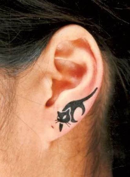 Awesome tattoo with cat on ear