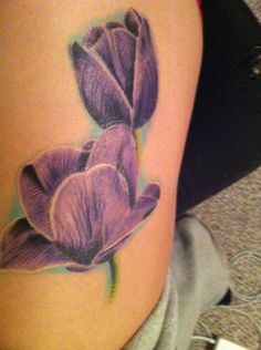 Beautiful tattoo with purple tulips