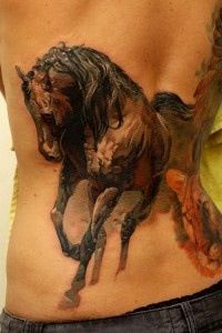 Big black horse tattoo on the back