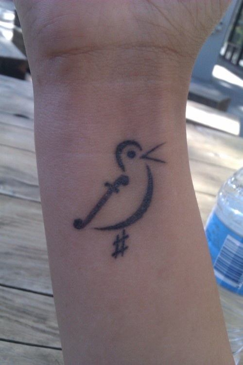 Bird-symbol-of-music-tattoo