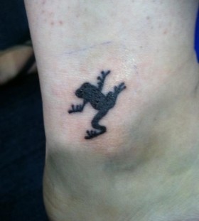 Black frog tattoo