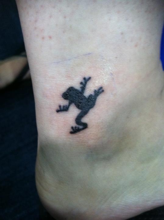 Black frog tattoo