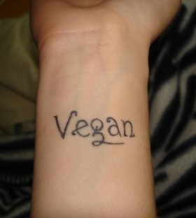 Black letters vegan tattoo
