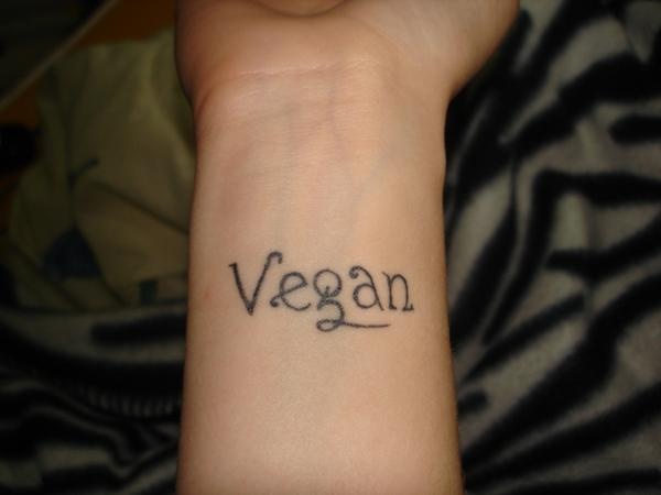 Black letters vegan tattoo