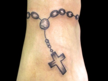 Black rosary wrist cross tattoo