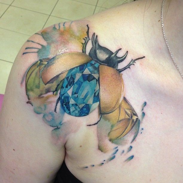 Colorful bug tattoo