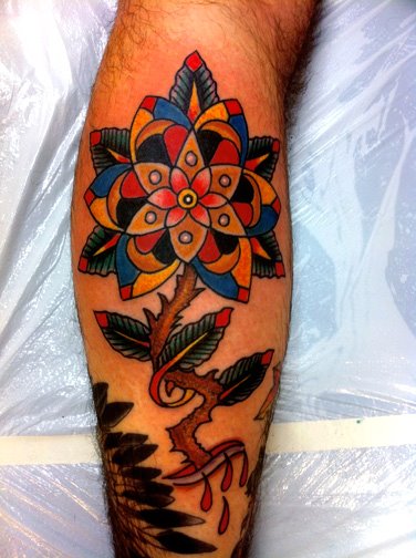 Colorful flower tattoo by Robert Ryan