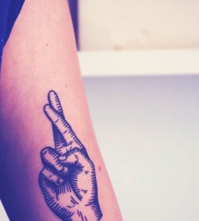 Crossed fingers minimalistic style tattoo