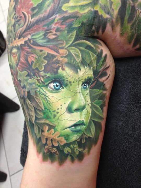 Cute green face tattoo