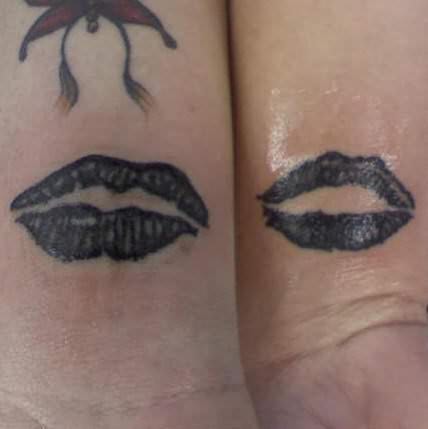 Cute tattoo of black lips