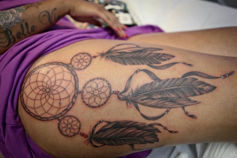 Feather tattoo by Hania Sobieski
