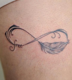 Feather tattoo by Nikki Ouimette