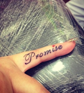 Finger promise tattoo