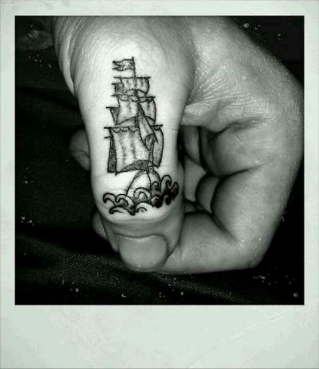 Finger ship tattoo