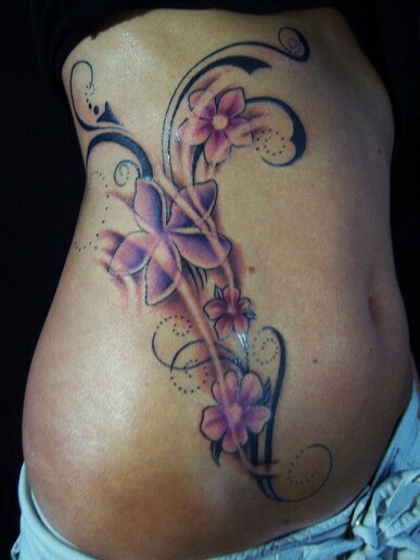 Flowers and ornaments woman purple tattoo