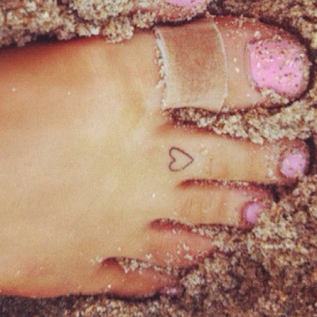 Foot finger tattoo