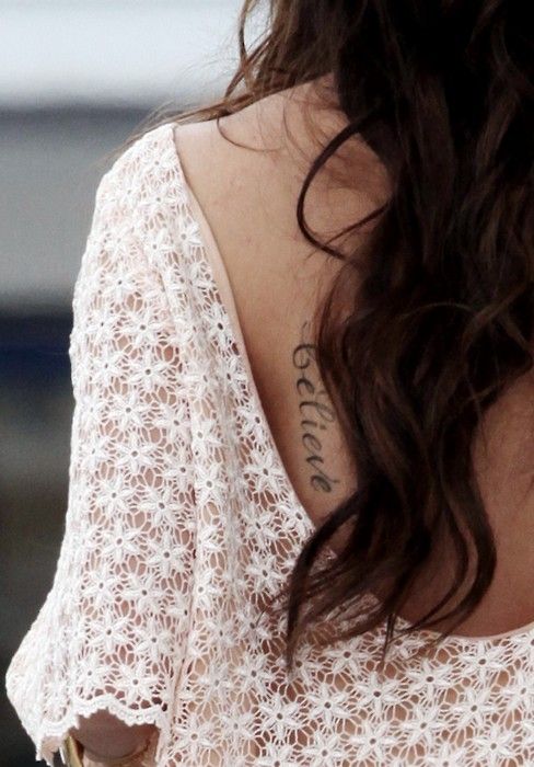 Gorgeous woman believe tattoo