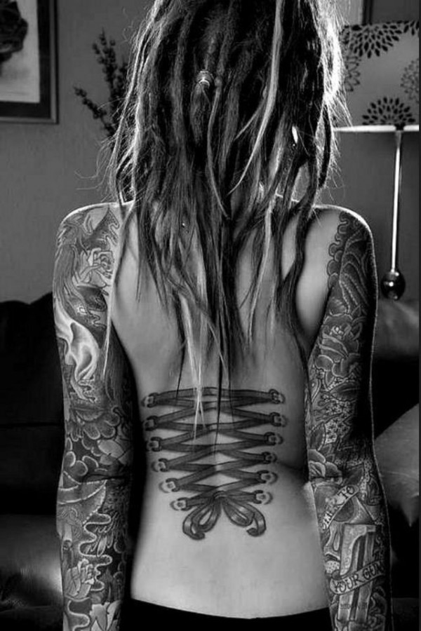 Hand and back corset tattoo