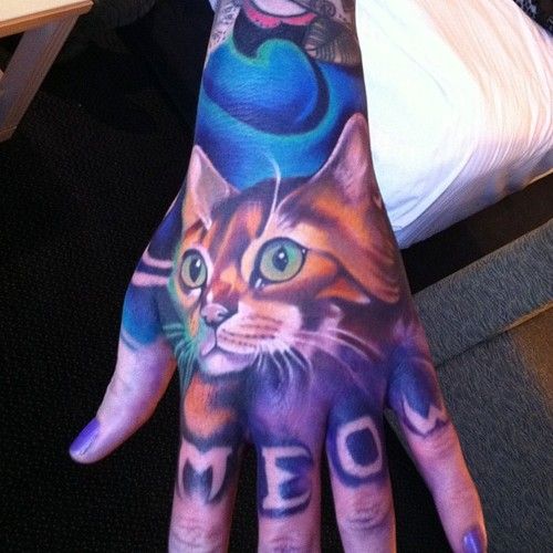 Hand cat tattoo