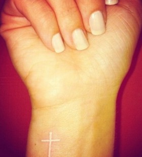 Hands cross tattoo