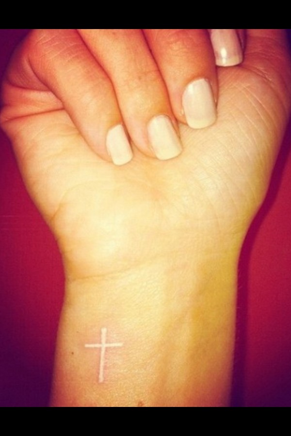 Hands cross tattoo