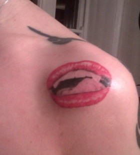 Impressive red lips tattoo