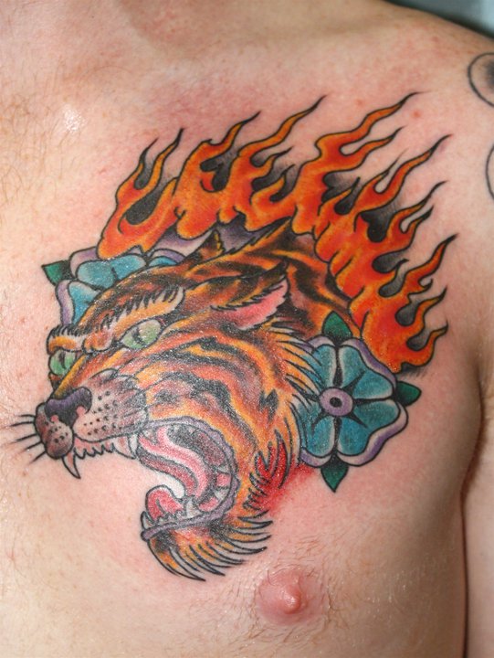 Lion tattoo by Mike Schweigert