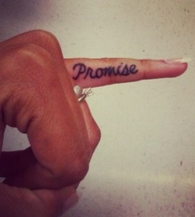 Lovely finger promise tattoo