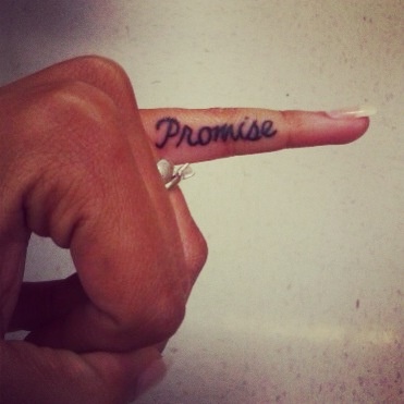 Lovely finger promise tattoo