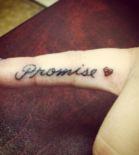 Lovely red heart and promise tattoo