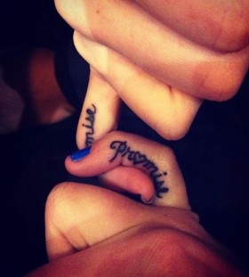 Lovley promise tattoo on finger