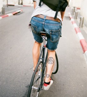 Man bike tattoo