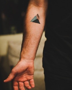 Man hand mountains tattoo