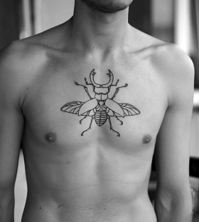 Men chest bug tattoo
