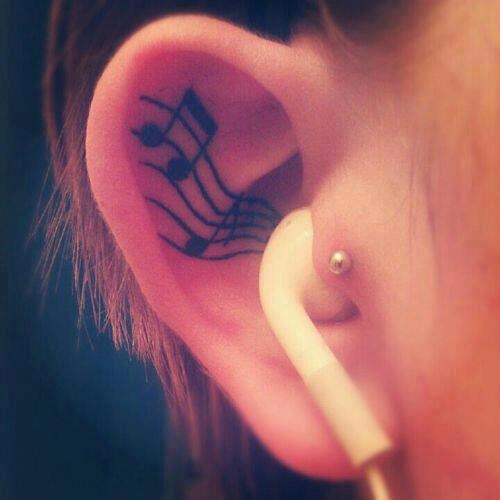 Music small tattoo in ear
