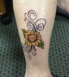 Ornaments and sunflower tattoo