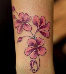 Pink flower tattoo by Nikki Ouimette