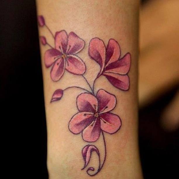 Pink flower tattoo by Nikki Ouimette