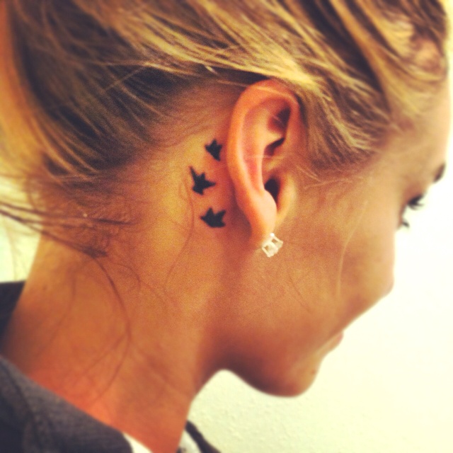 Pretty ear small tattoo
